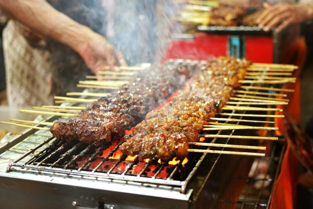 Photo by Nita Anggraeni Goenawan grilled meat on charcoal grill