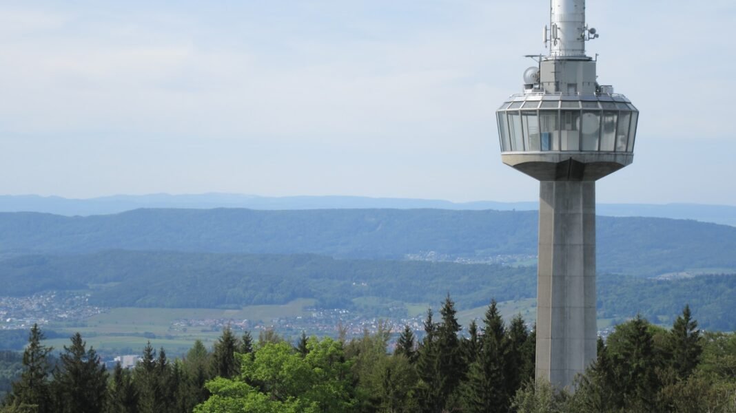 Photo by A Noyara R white concrete tower on top of mountain during daytime