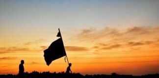 Sajak Perjuangan dan Harapan silhouette of a flag on a pole during sunset