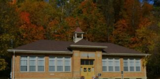 Profil MTs N 00 Banjar A school building with a clock tower in front of it