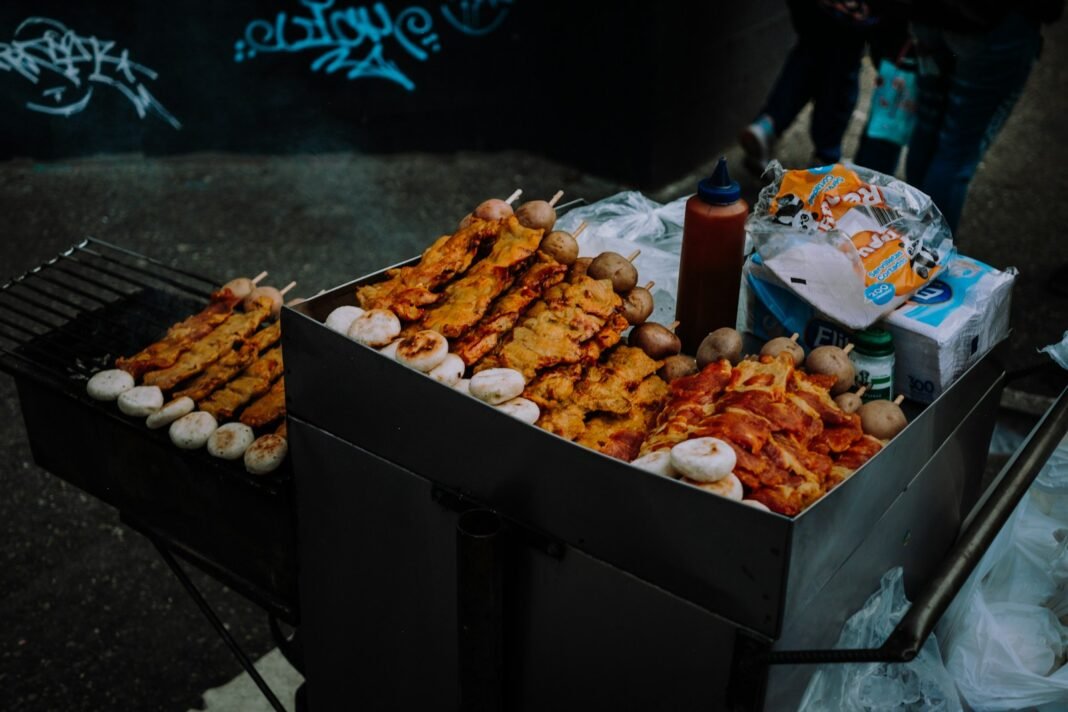 Photo by Rizvi Rahman a box of food sitting on top of a grill