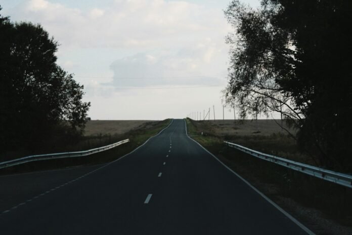 An empty road stretches towards the horizon.