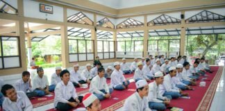 Profil MAN 00 Banjar a group of men sitting on top of a red rug